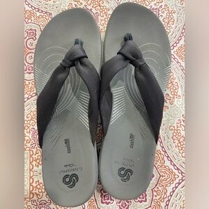 Black Clark’s flip flops